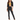A model poses in a cropped black blazer over a yellow bikini, paired with fitted black pants featuring slits.