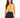 A model poses in a yellow bralette with thin straps, paired with high-waisted black leggings.