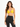 A model poses in a yellow bralette with thin straps, paired with high-waisted black leggings.