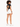 A model with curly hair wears a black cropped top with a back cutout, paired with white shorts and sneakers.