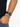 A close-up of a wrist featuring a beaded bracelet with gray and black stones, paired with a sleek watch.