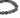 A close-up of a beaded bracelet featuring dark round stones and hexagonal accents in varying shades of gray.