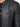 Close-up of a black leather jacket featuring a zippered pocket and ribbed shoulder detailing.