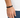 A close-up of a hand wearing a black beaded bracelet with a sleek clasp, set against a light background.