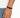 A close-up of a hand wearing a double-stranded brown leather bracelet with a black clasp.