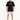 A man stands wearing a black oversized t-shirt and light gray rolled-up shorts, paired with white sneakers.