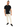 A man stands confidently in a black t-shirt and cream joggers, paired with black sneakers.