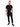 A man stands confidently in a black t-shirt and matching joggers, showcasing a casual streetwear style.