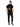 A person wearing a black t-shirt with a graphic design on the back, paired with black joggers and sneakers.