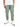 Light green cargo pants with multiple pockets, paired with a white t-shirt and white sneakers.