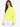 A model wearing a bright neon yellow turtleneck top with wide sleeves, paired with white pants.