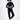 A model poses in a black cropped sweatshirt and matching joggers, paired with white sneakers.