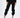 Black jogger pants with a relaxed fit, featuring an elastic waistband and cuffed ankles, paired with white sneakers.