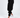 A model wearing black jogger pants paired with white sneakers, showcasing a relaxed fit and elastic cuffs.