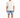 A man stands wearing a loose-fitting beige t-shirt and distressed denim shorts, paired with white sneakers.