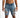 A man wearing distressed denim shorts with multiple rips and a light wash, standing against a white background.