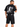 A person wearing a black graphic t-shirt with a silhouette design and black denim shorts, viewed from behind.