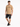 A man wearing a tan t-shirt with a graphic design, paired with black distressed shorts and sneakers.