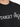 Black t-shirt featuring bold white text and star graphics, showcasing a modern, casual style.
