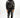 A model wearing a black hoodie and sweatpants featuring intricate silver coral designs.