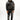 A model wearing a black hoodie and sweatpants featuring intricate silver coral designs.