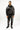 A model wearing a black hoodie and sweatpants featuring intricate silver coral designs.