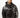 A man wearing a black hoodie with intricate white coral-like designs on the sleeves and a front pocket.
