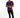 A man stands confidently in a purple short-sleeve shirt and black jeans, wearing white sneakers.