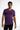A man wearing a fitted purple t-shirt with motivational text printed across the chest, paired with black jeans.