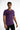 A model wearing a fitted purple t-shirt with motivational text printed across the chest, paired with black jeans.