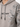 A light gray sweatshirt featuring a hood, decorative leaf patterns, and bold text on the front.