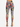 Colorful patterned leggings featuring abstract designs and script, paired with stylish black heels.
