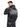 A man wearing a black hoodie with a lightning design and bold white lettering on the back.
