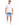 A man stands confidently in a fitted white short-sleeve shirt paired with light blue denim shorts and white sneakers.