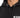 Close-up of a black hoodie featuring a drawstring hood and bold white text on the front.