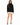 Celine Sweater in Black – full-length front view of a turtleneck with frayed fringe hem, worn with a white skirt