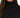 Celine Sweater in Black – close-up of the ribbed turtleneck collar and knit texture on a model