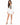 Nina Jacket Set in White – full-length front view of cropped blazer with brown buttons and asymmetric mini skirt