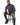 Tyson Sweater in Charcoal Grey – seated front view of the turtleneck with ripped black jeans