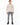 Romeo Turtleneck Sweater in Beige – full-length front view on a model with ribbed cuffs and hem, gray ripped jeans