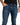 Finn Jeans in Blue Wash – front close-up on a model showing the silver zip pull and button
