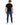 Finn Jeans in Mid Blue – full-length back view on a model, with faded wash and back pockets, styled with a black tee