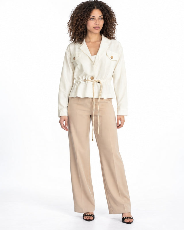 Rhea Jacket in Off-White – full-length front view with rope drawstring waist, worn with beige wide-leg pants