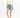 Model in a clay asymmetrical one-shoulder cropped sweatshirt, distressed denim shorts, and white sneakers.