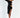 Model in Valeria black mini dress featuring one-shoulder long sleeve and trendy side cut-outs with ring details.