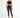 Model wearing a black Carbon Knit crochet halter top with high-waisted black jeans and strappy heels.