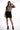 Model wears the Elora long-sleeve nude and black baroque print bodysuit with a crew neckline and body-contouring fit.