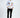 A young man stands confidently in a white long-sleeve shirt adorned with colorful graphics and text, paired with blac...