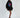 Model in black Lips Graphic oversized hoodie dress with ruched sleeves, streetwear aesthetic for Gen Z fashion.