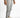 Men's Odin light grey slim fit jeans with distressed knee details, styled with white sneakers for a streetwear look.